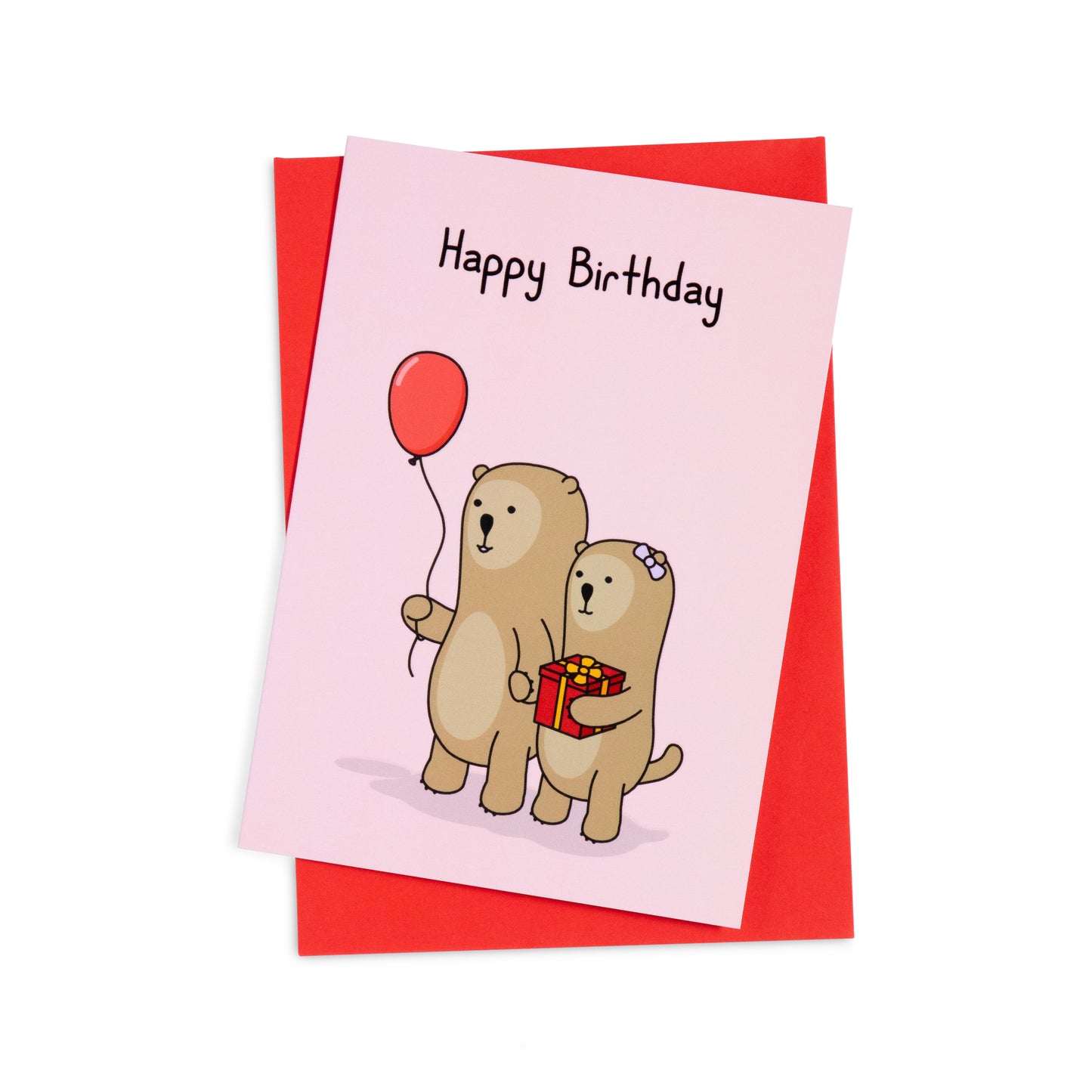 A red birthday greeting card with a cheerful illustration of otters going to a party one holding a balloon, the other holding a present. The text on the card reads 'Happy Birthday!'.