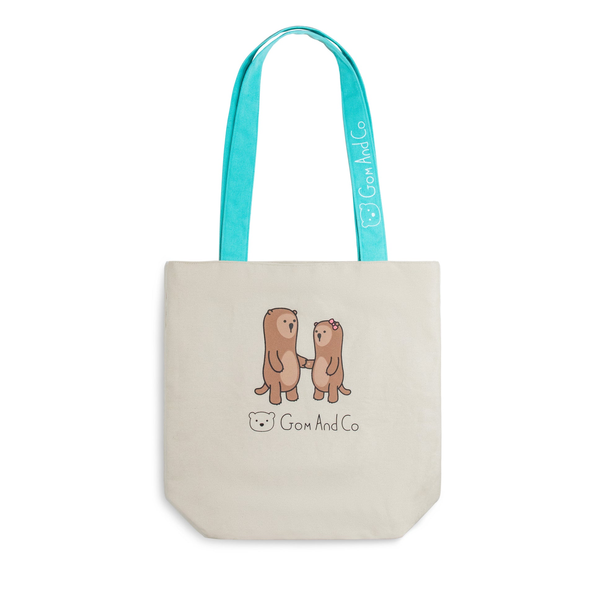 A canvas tote bag with aqua coloured handles and aqua lining. Two otters are shown holding hands on both sides.